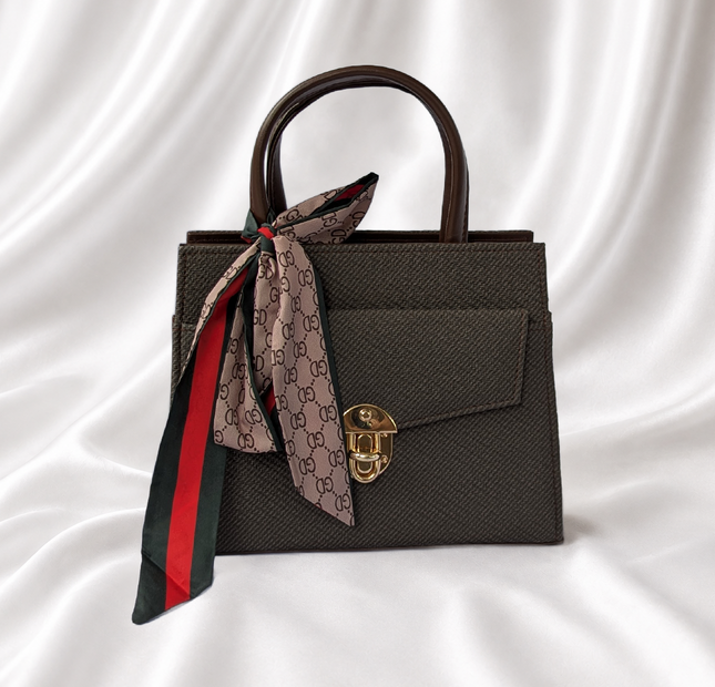 Espresso brown structured mini top handle handbag with gold-tone turn lock and decorative printed twilly scarf.