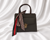 Espresso brown structured mini top handle handbag with gold-tone turn lock and decorative printed twilly scarf.