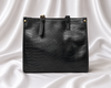 Luxury black crocodile-embossed women's tote bag with gold-tone hardware by Eisela.