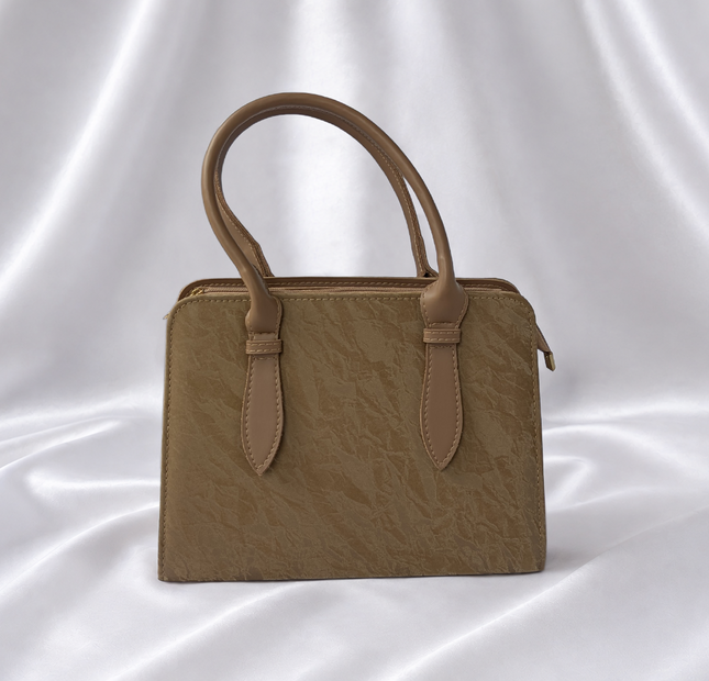 Luxury sandstone beige women's structured top handle handbag with textured finish by Eisela.