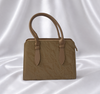Luxury sandstone beige women's structured top handle handbag with textured finish by Eisela.